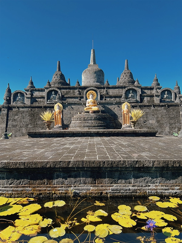 Miniature of Borobudur Temple at Brahmavihara-Arama - detailed replica of the iconic Javanese monument in a serene Buddhist temple complex in Bali