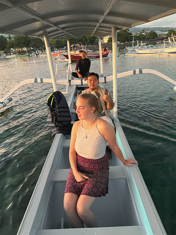 Lovina Dolphin Sunrise Tour in North Bali - traditional outrigger boat ride to watch wild dolphins at sunrise, peaceful ocean experience, top early morning activity in Bali
