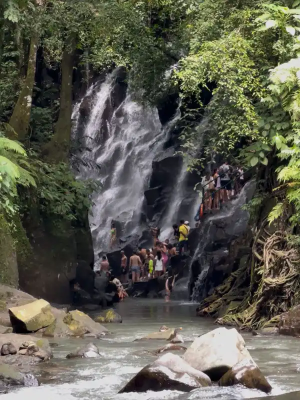 Kanto Lampo Waterfall Bali - beautiful cascading waterfall in Gianyar surrounded by lush jungle, natural rock formations with clear flowing water, hidden gem near Ubud, perfect spot for photography and nature exploration, Bali waterfall adventure and sightseeing tour